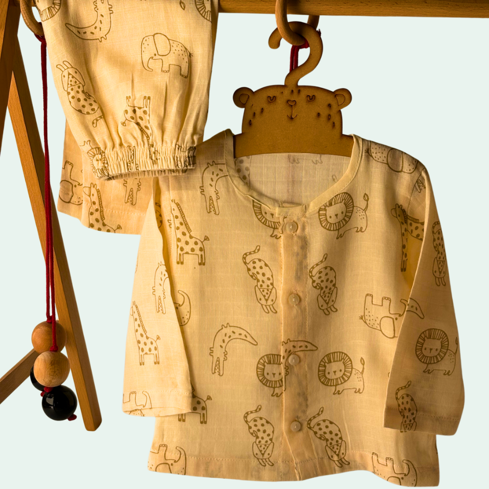 “Organic muslin baby night suit set in beige with animal print, soft breathable fabric on hanger”