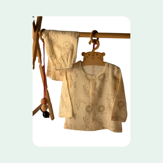 “Organic cotton baby night suit in beige with cute animal print, soft breathable fabric”