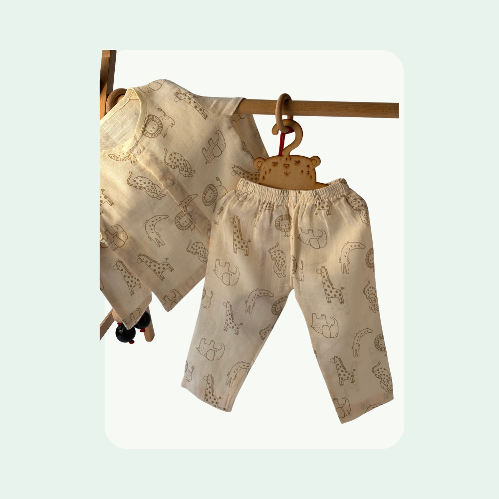 “Organic cotton baby night suit set on hanger in beige with animal print”